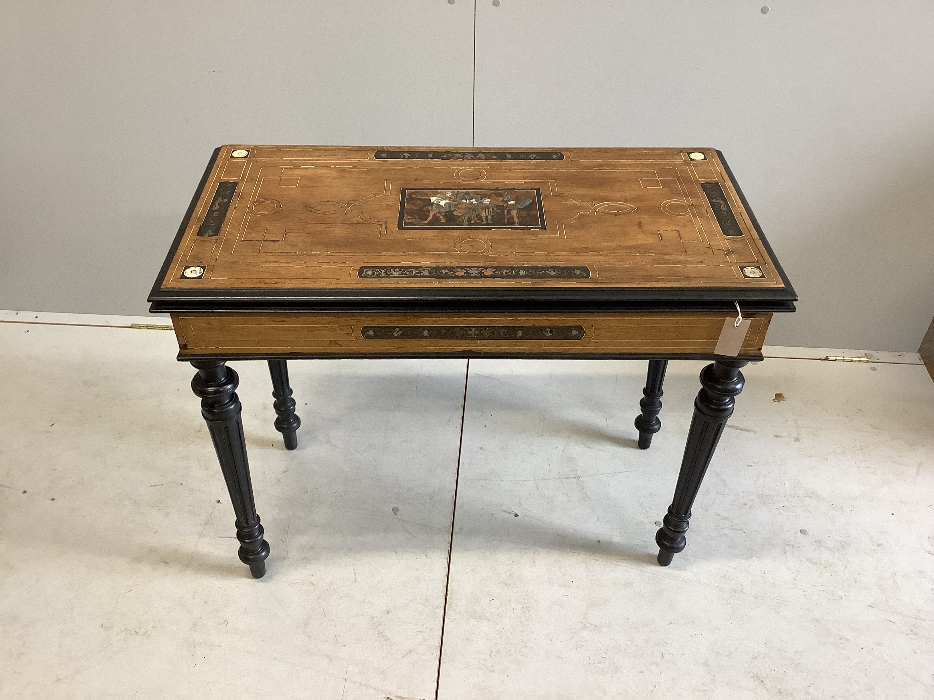 A late 19th century Italian copper, brass and bone marquetry inlaid walnut and ebonised folding card table, width 94cm, depth 46cm, height 75cm